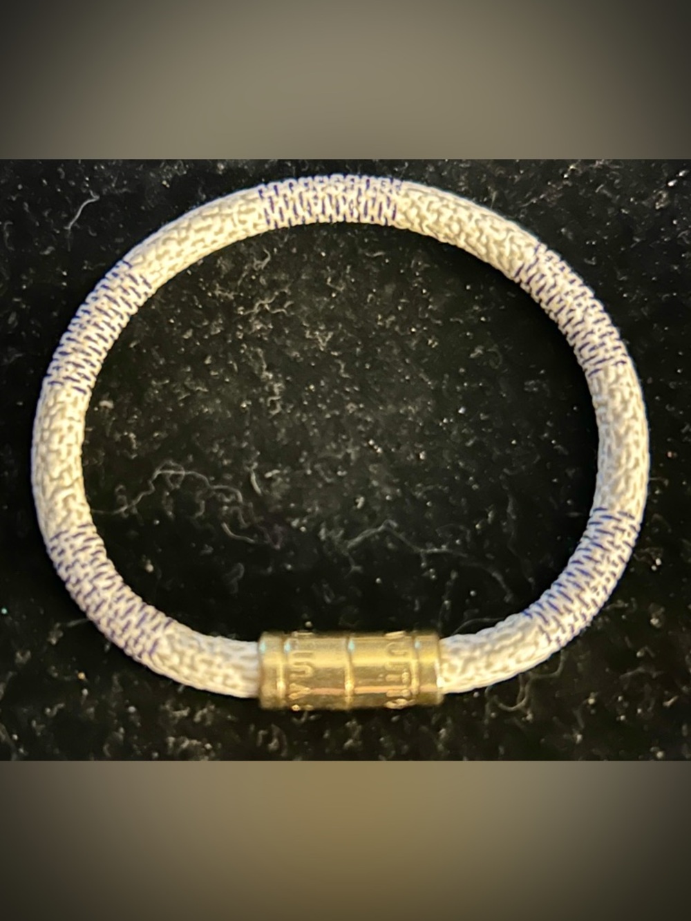 Louis Vuitton Keep It bracelet is designed with the label's Damier Azur canvas!